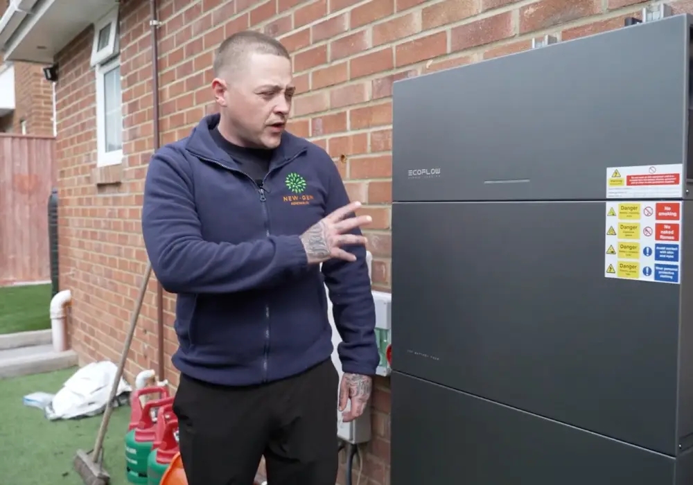 New Gen team member demonstrating a newly installed EcoFlow battery
