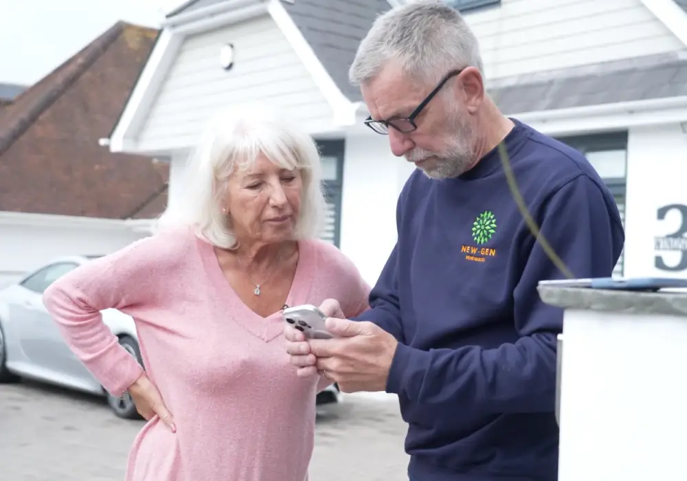Phil showing a customer their solar monitoring app